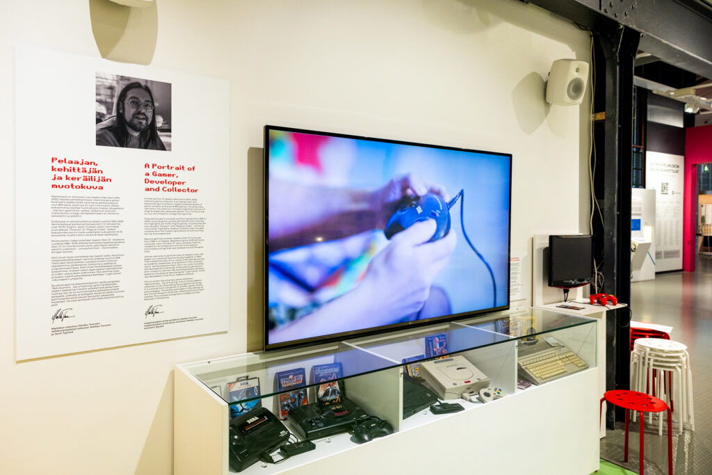 The Finnish museum of Games, exhibition has a large screen on the wall.